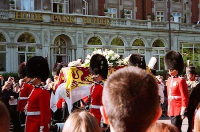 Coffin being transported past Hyde Park Hotel